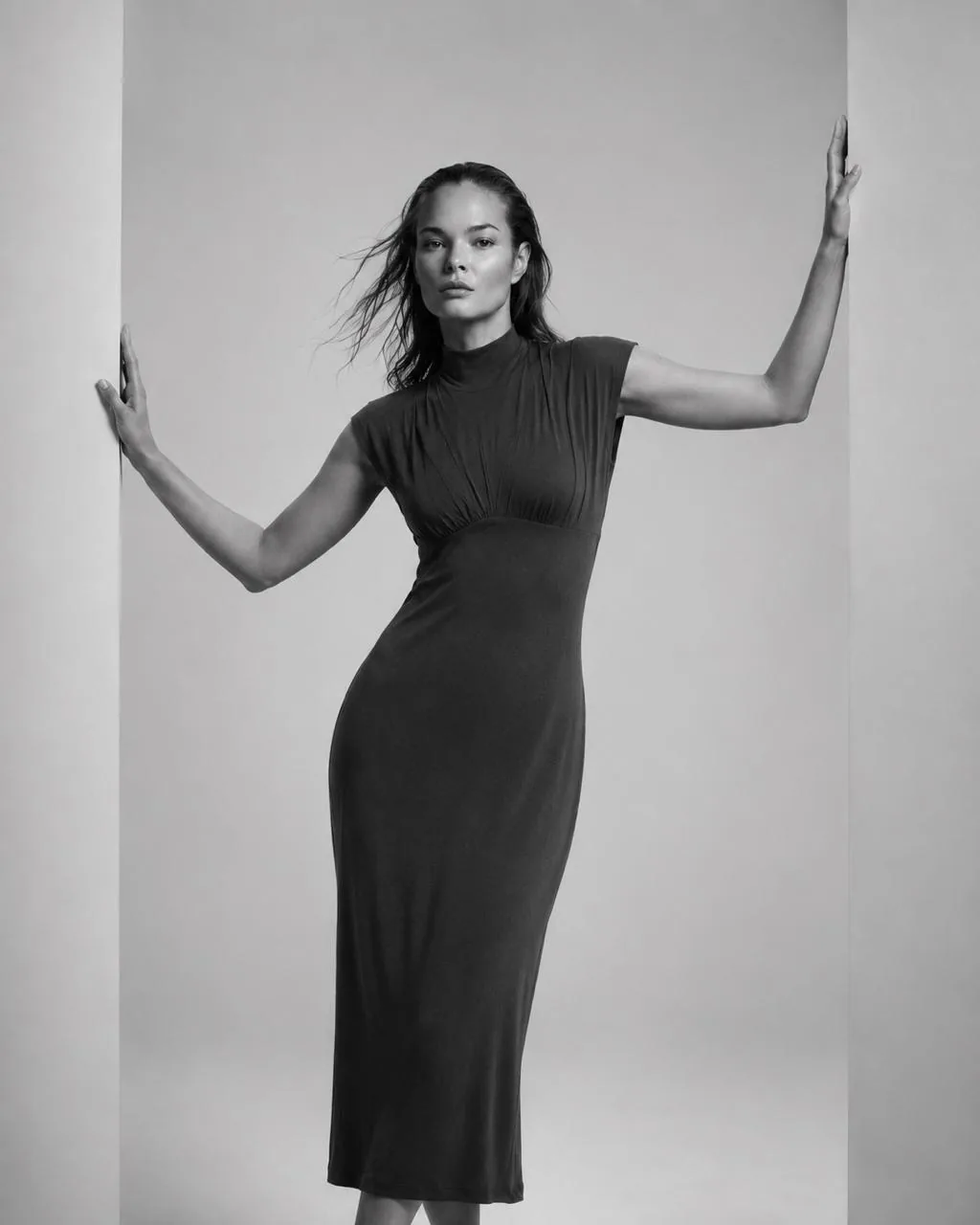 Black-and-white full-length front view of the midi with cap shoulders and ruched underbust seam.