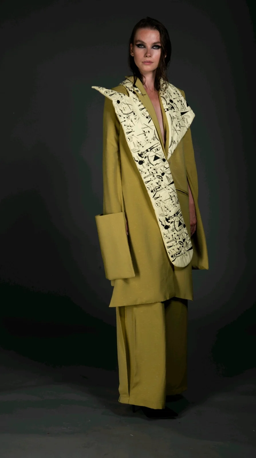 Side three-quarter view — the panel worn to the front with the oversized patch pocket visible.