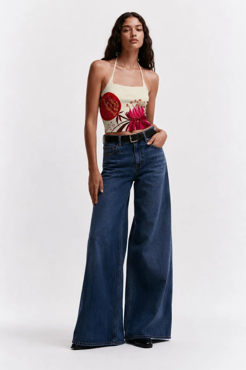 Malibu bloom top worn with belted wide-leg denim, full front view.