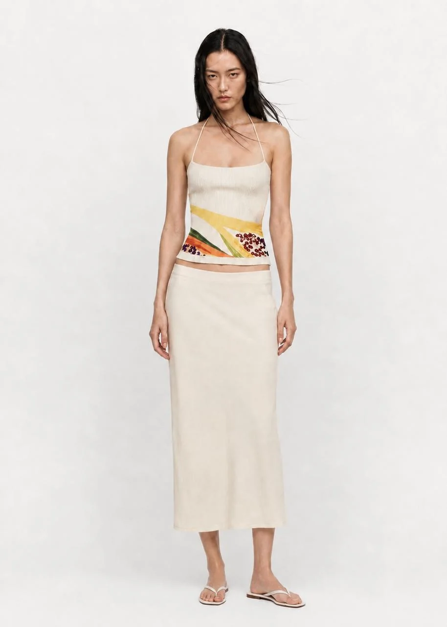 Zesty top worn with a cream maxi skirt, full front view.