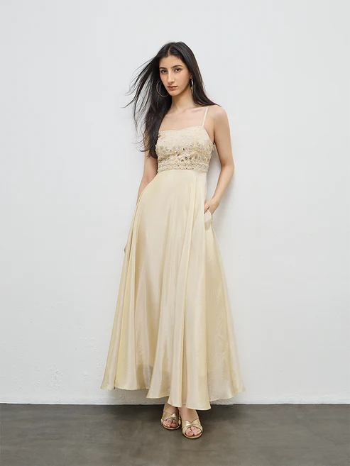Finished gown, full front view against a studio wall.