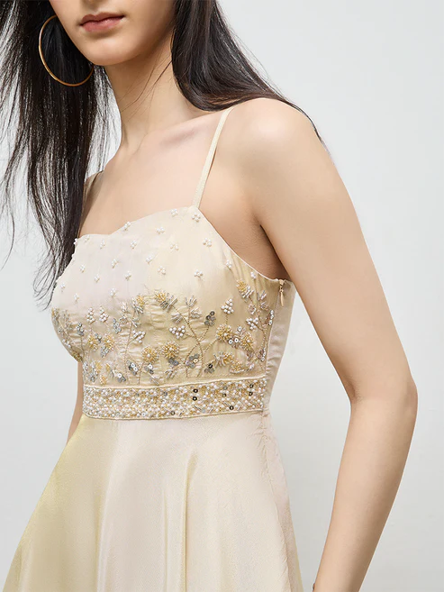 Close-up of the beaded bodice and embellished waist belt.
